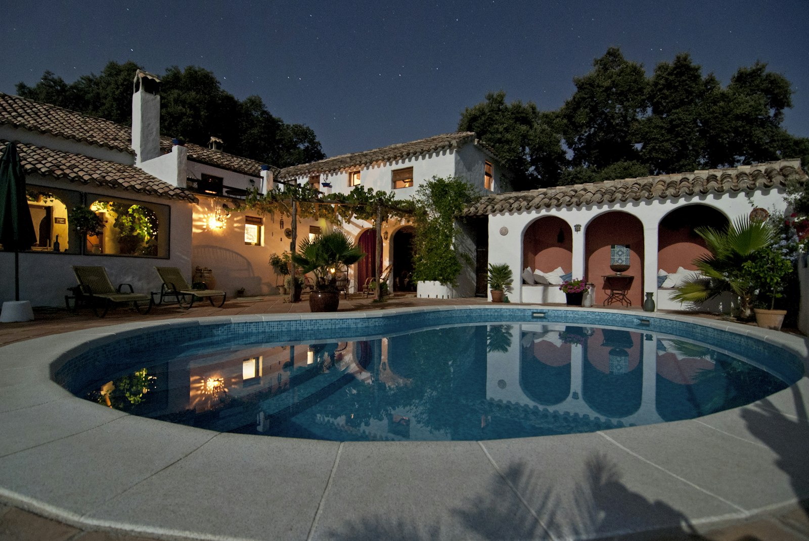 Illuminated estate pool after dark — Boca Raton